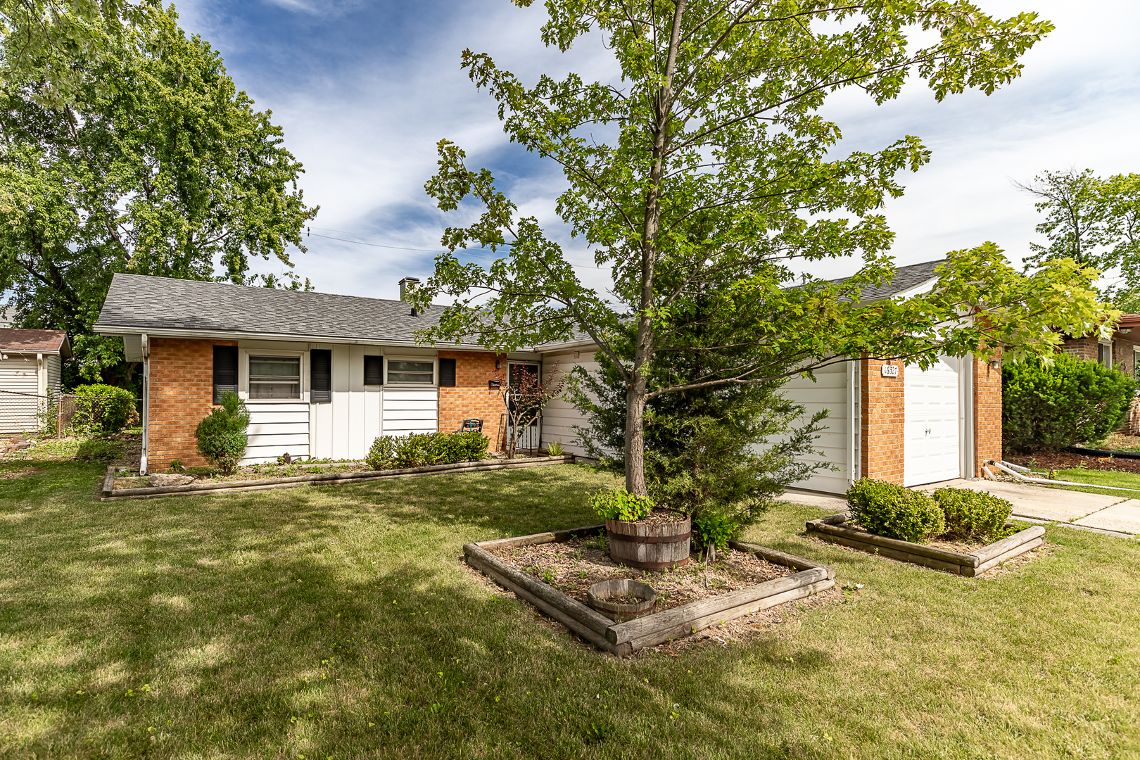 a front view of house with yard outdoor seating and green space