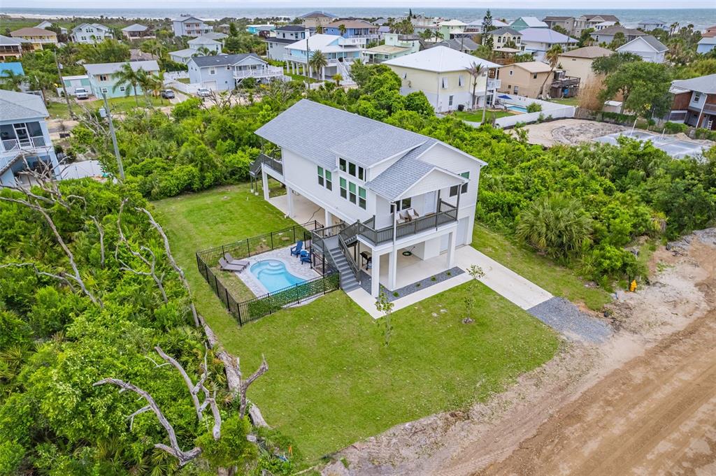 an aerial view of a house with a garden