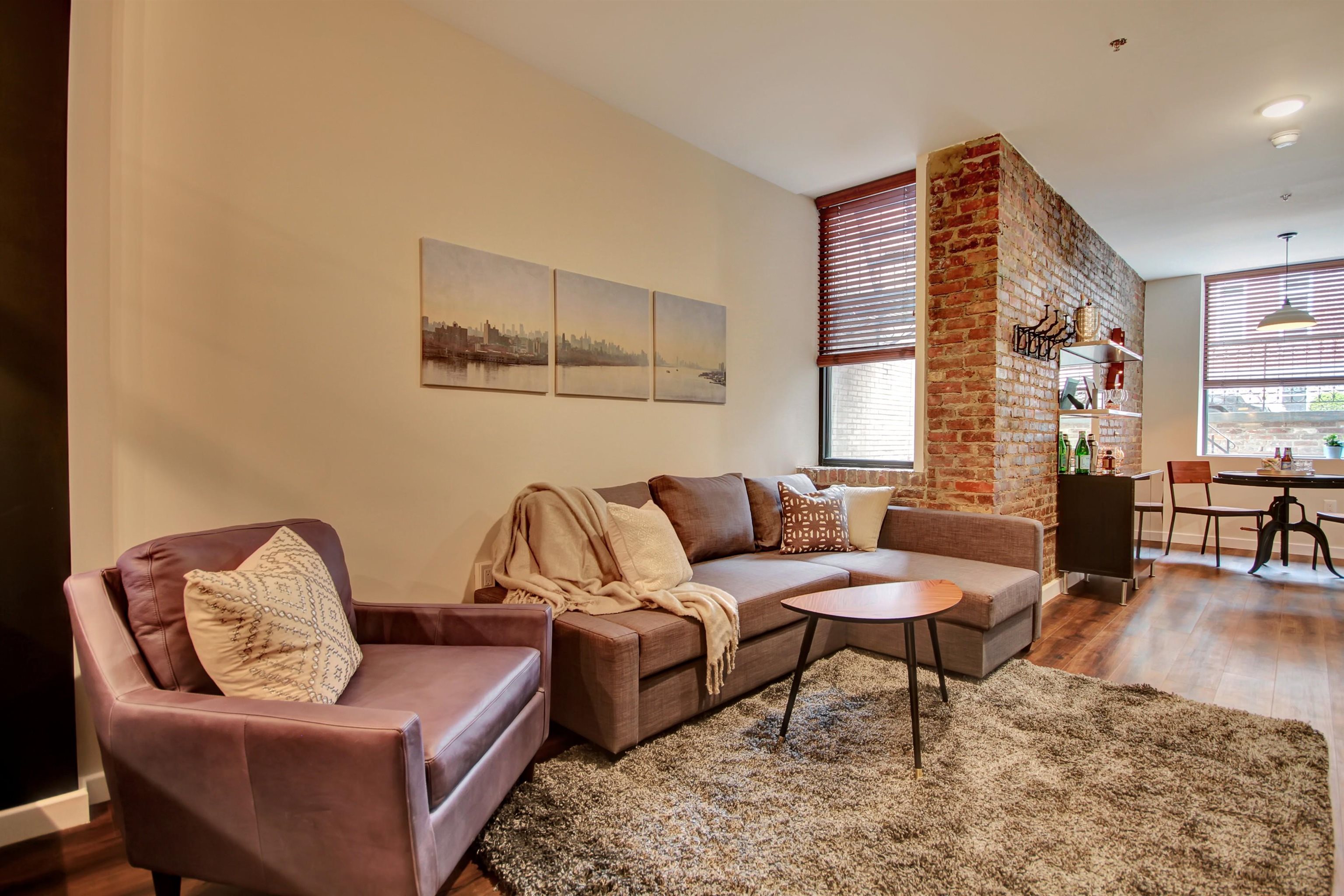 a living room with furniture and a rug