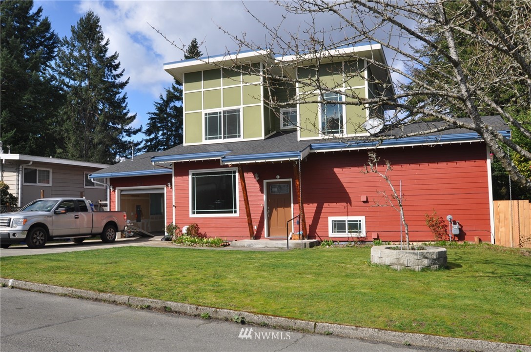 front view of a house with a yard