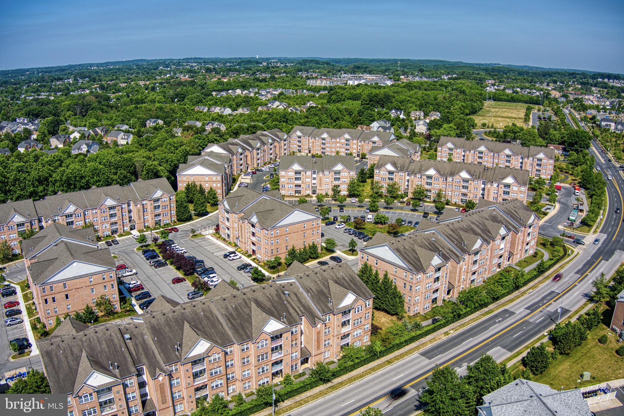 an aerial view of a city with lots of residential buildings