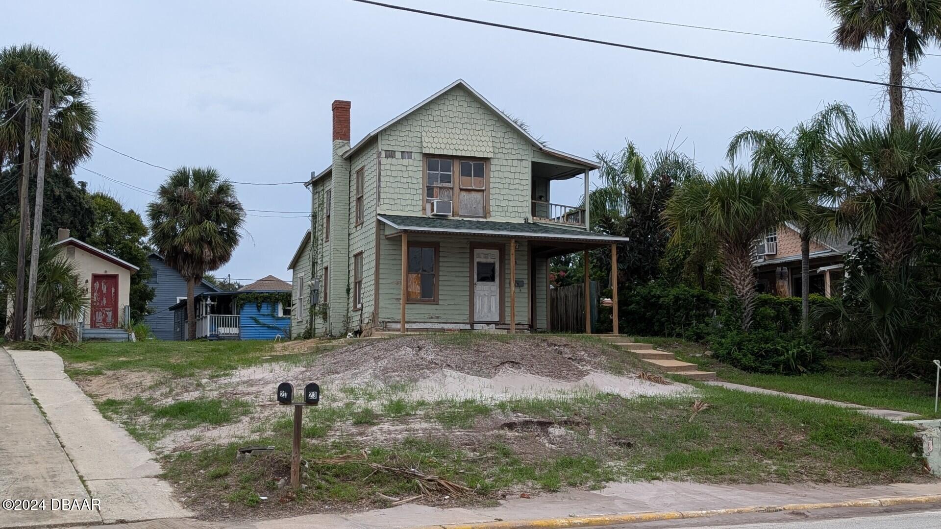 a front view of a house with garden