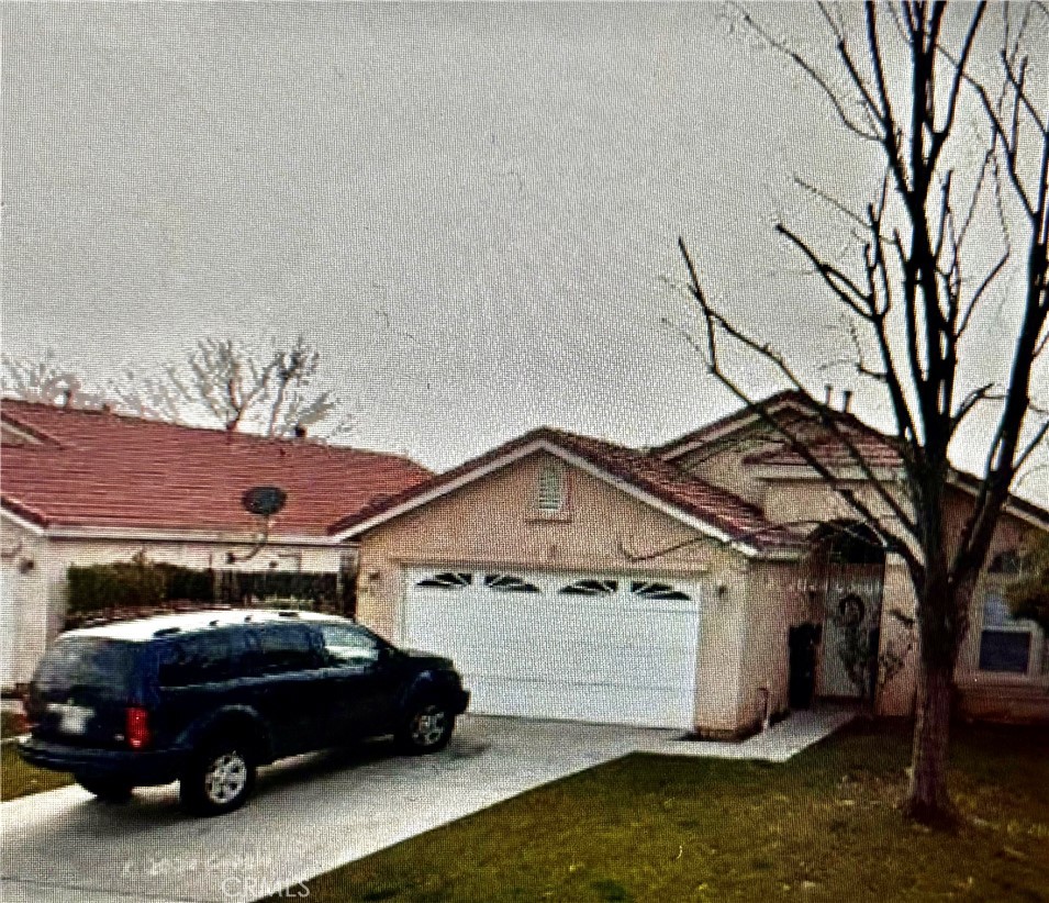 a view of a car parked in front of a house