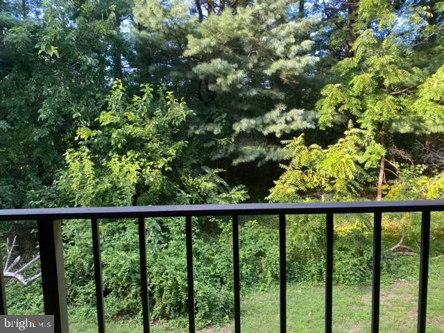 a view of a balcony with a tree