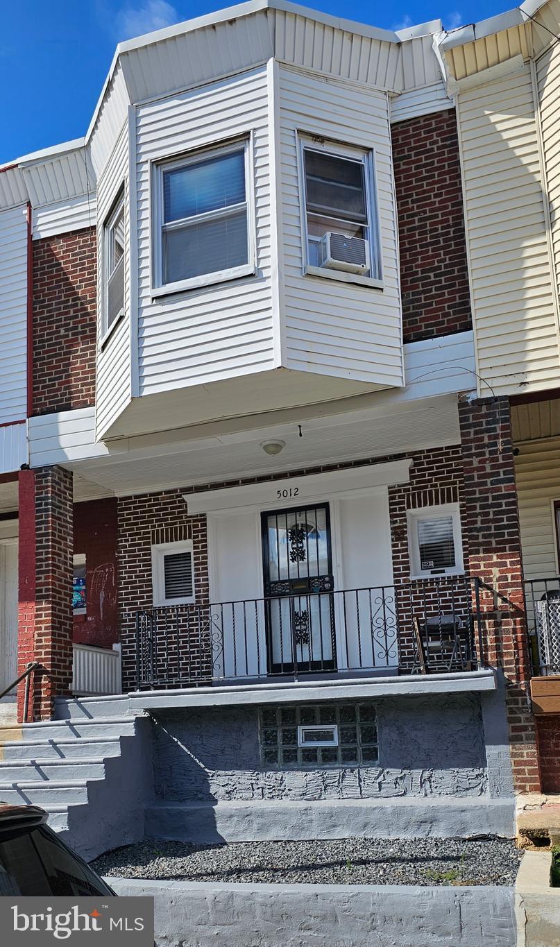 a front view of a house with balcony