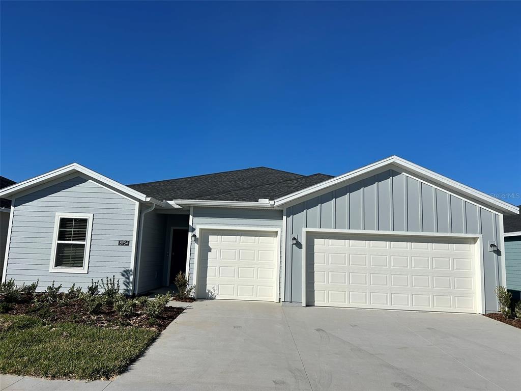 a front view of a house with garage