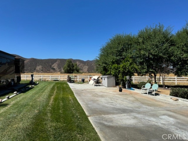 a view of a backyard with swimming pool