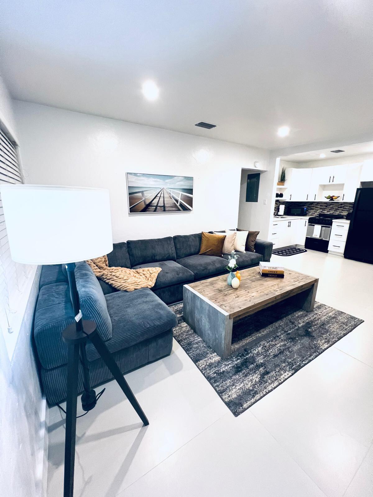 a living room with furniture and a rug