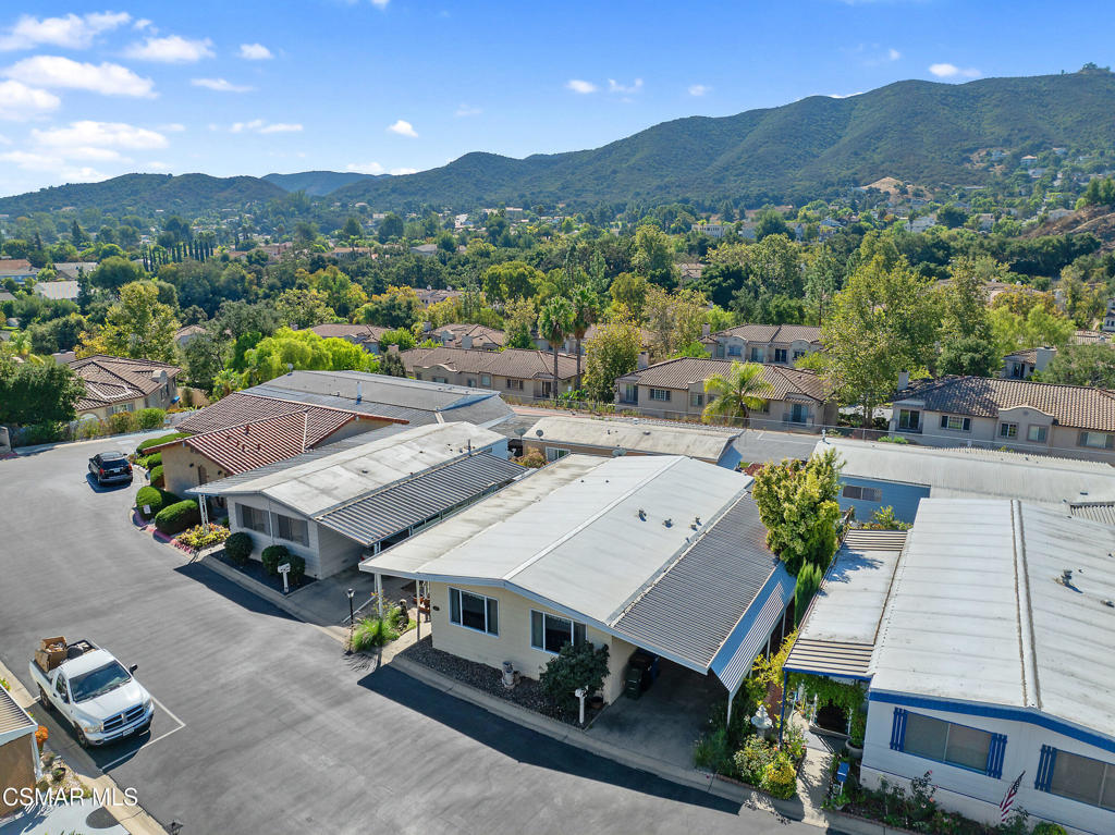 an aerial view of a house with a big yard