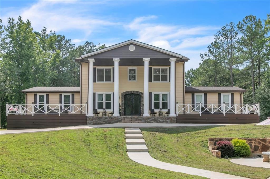 front view of a house with a yard