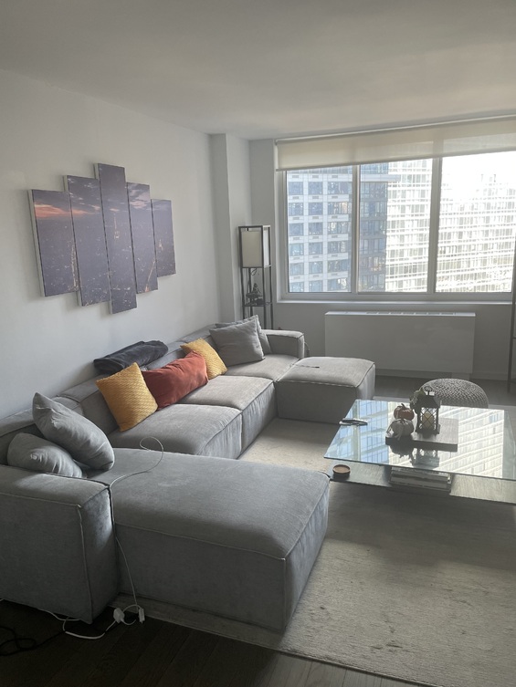 a living room with furniture and a window