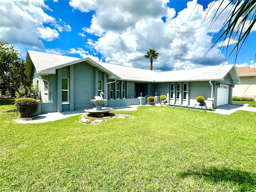 a view of a house with swimming pool and porch