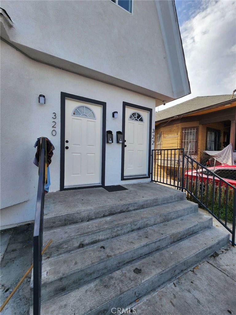 a view of a porch with wooden floor and stairs