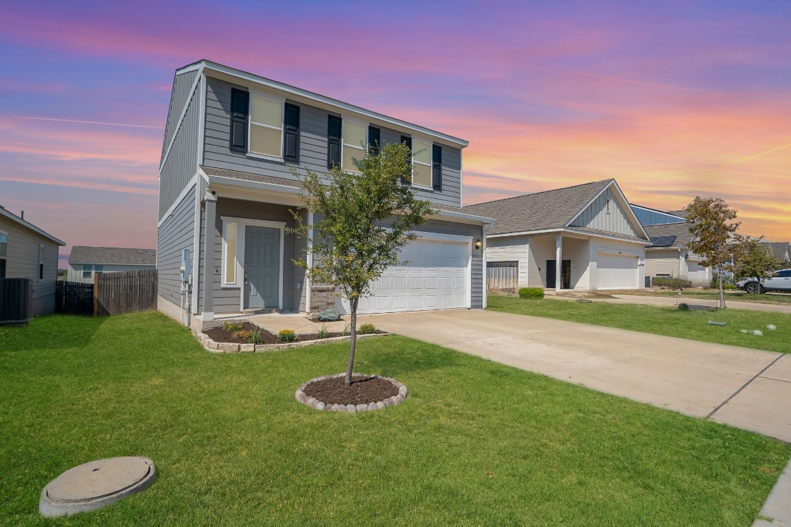 a front view of a house with a yard