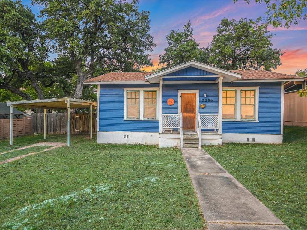 a front view of a house with yard