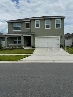 a view of a house with a yard and sitting space