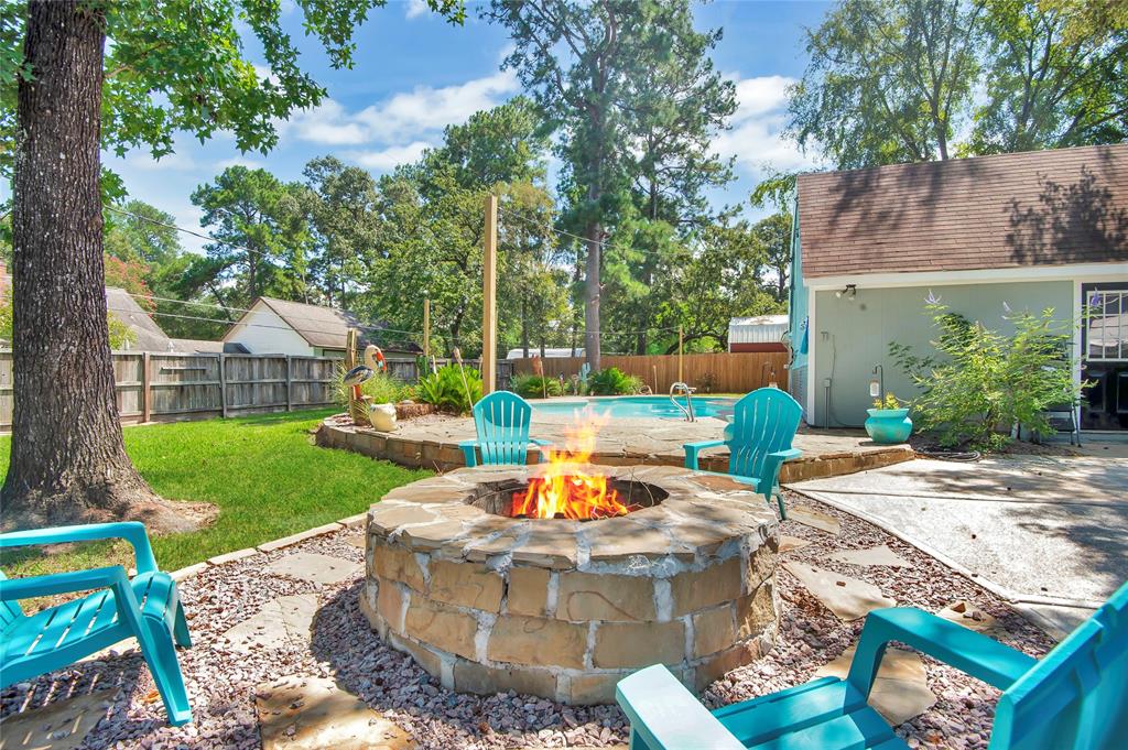 a view of a house with backyard sitting area and garden