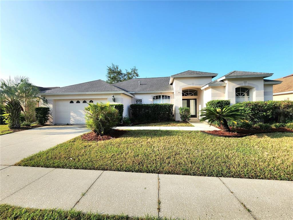 a front view of a house with a yard