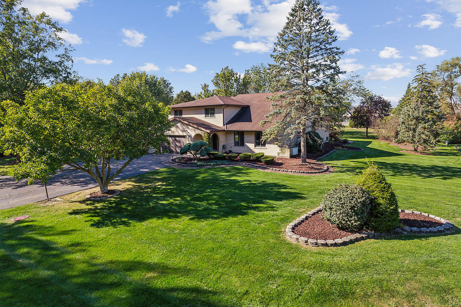 a view of a garden with a house