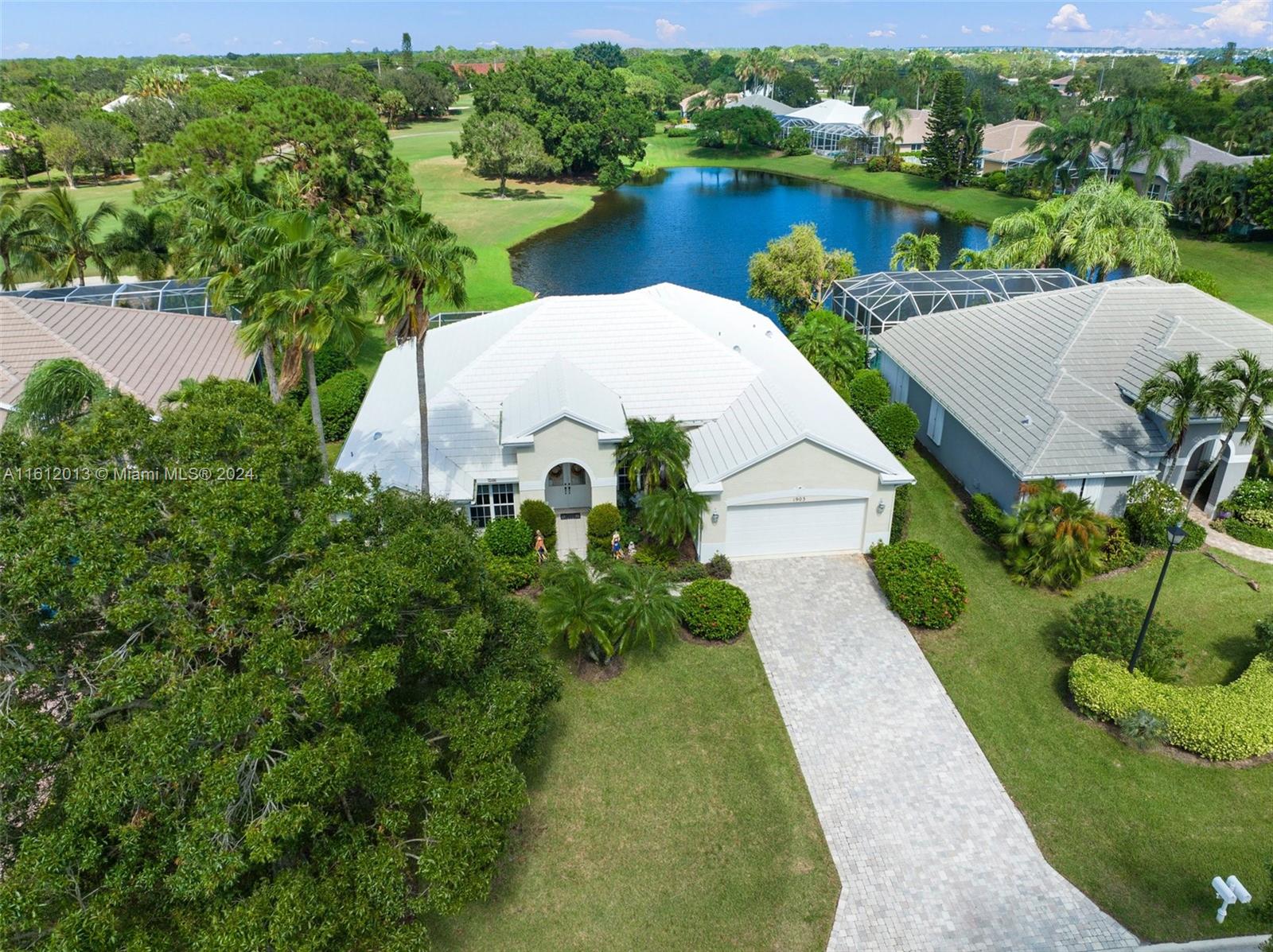 an aerial view of a house with a lake view