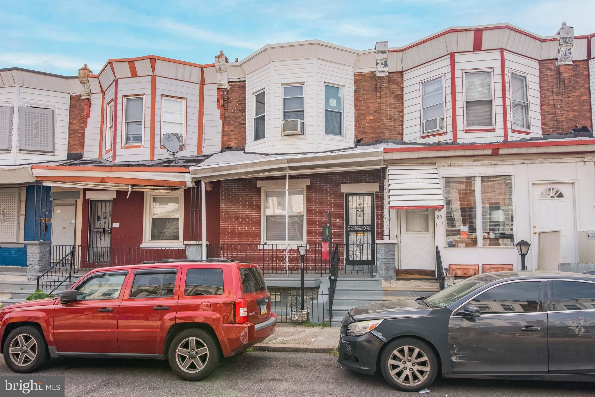 a front view of a house with parking space