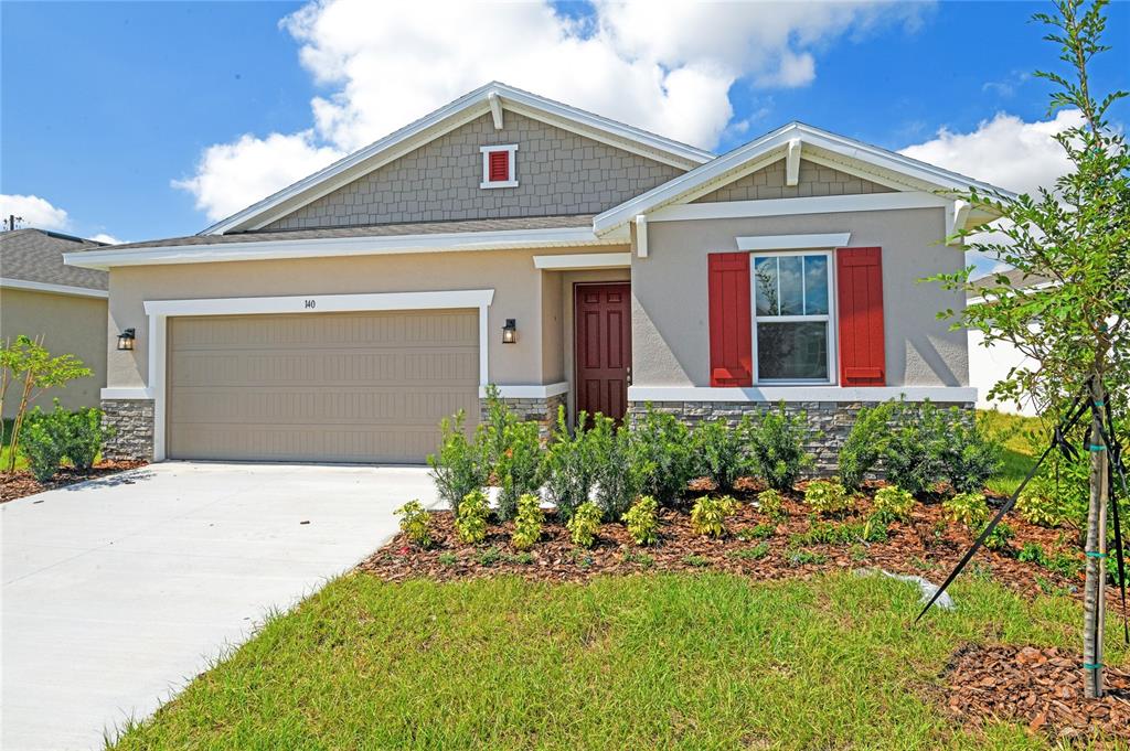 front view of a house with a yard