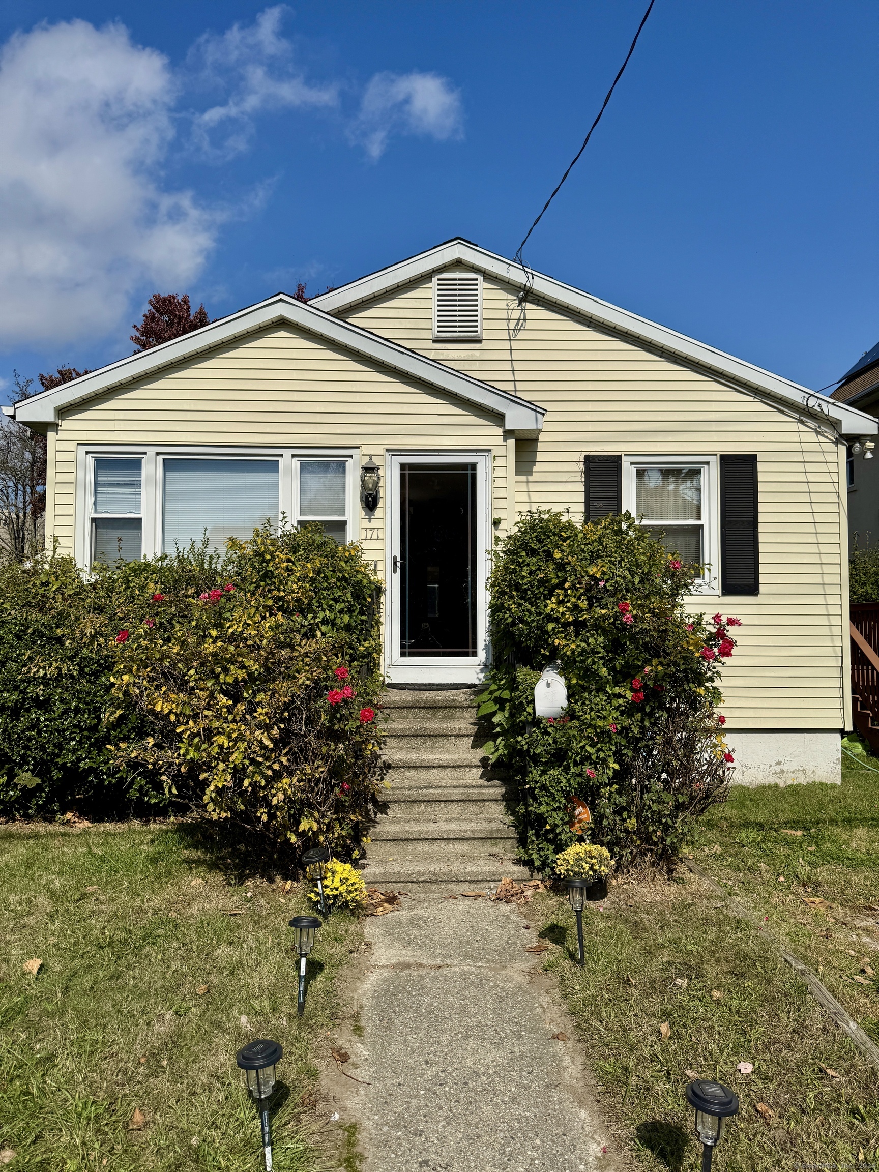 a front view of house with yard