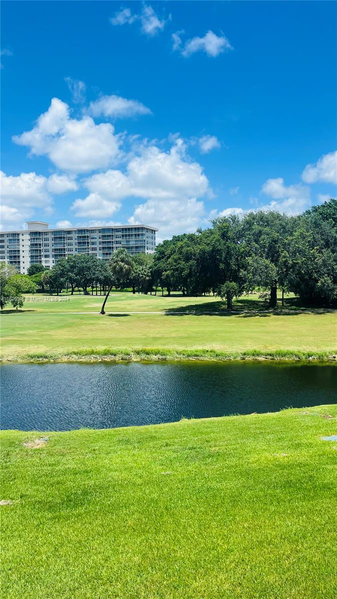 a view of a golf course with a lake