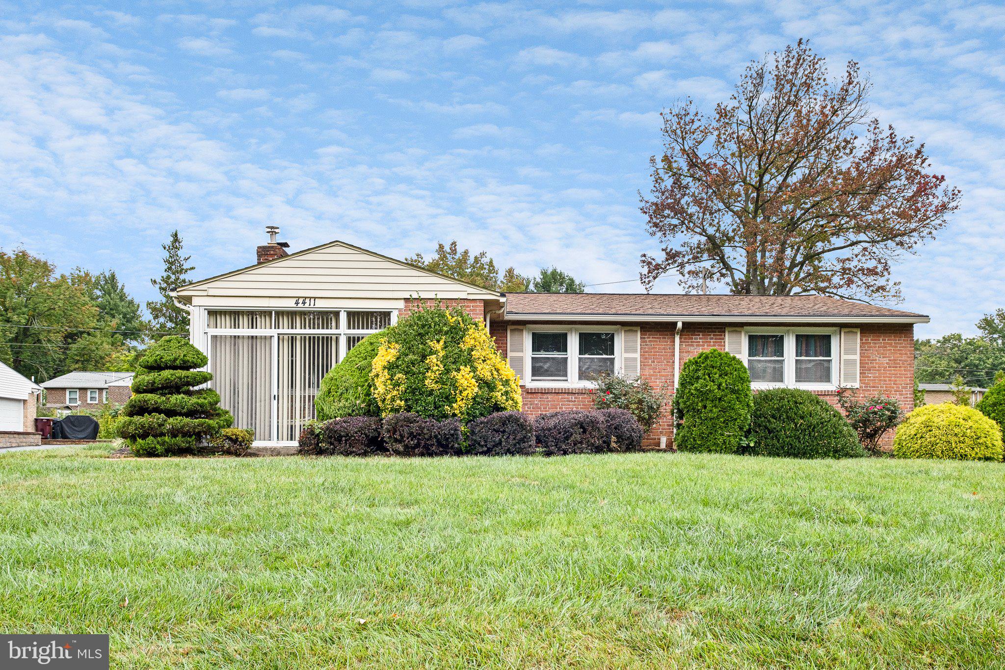 front view of a house with a yard