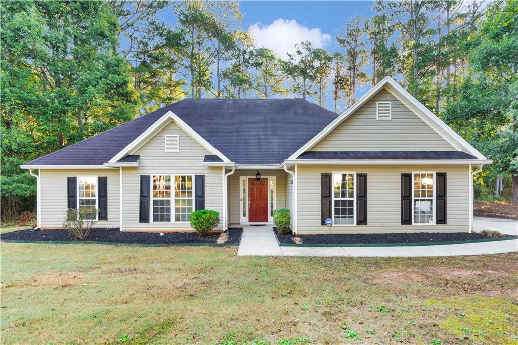 a front view of a house with a yard