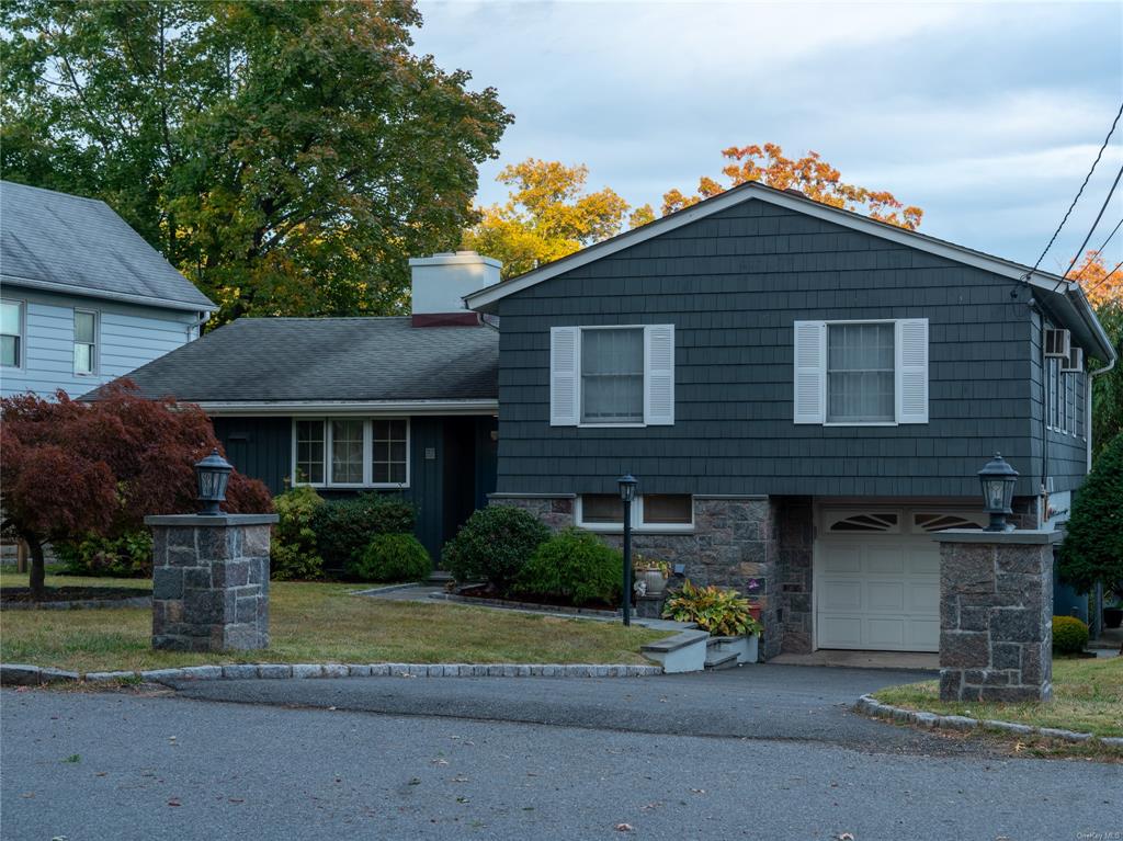 Tri-level home featuring a garage