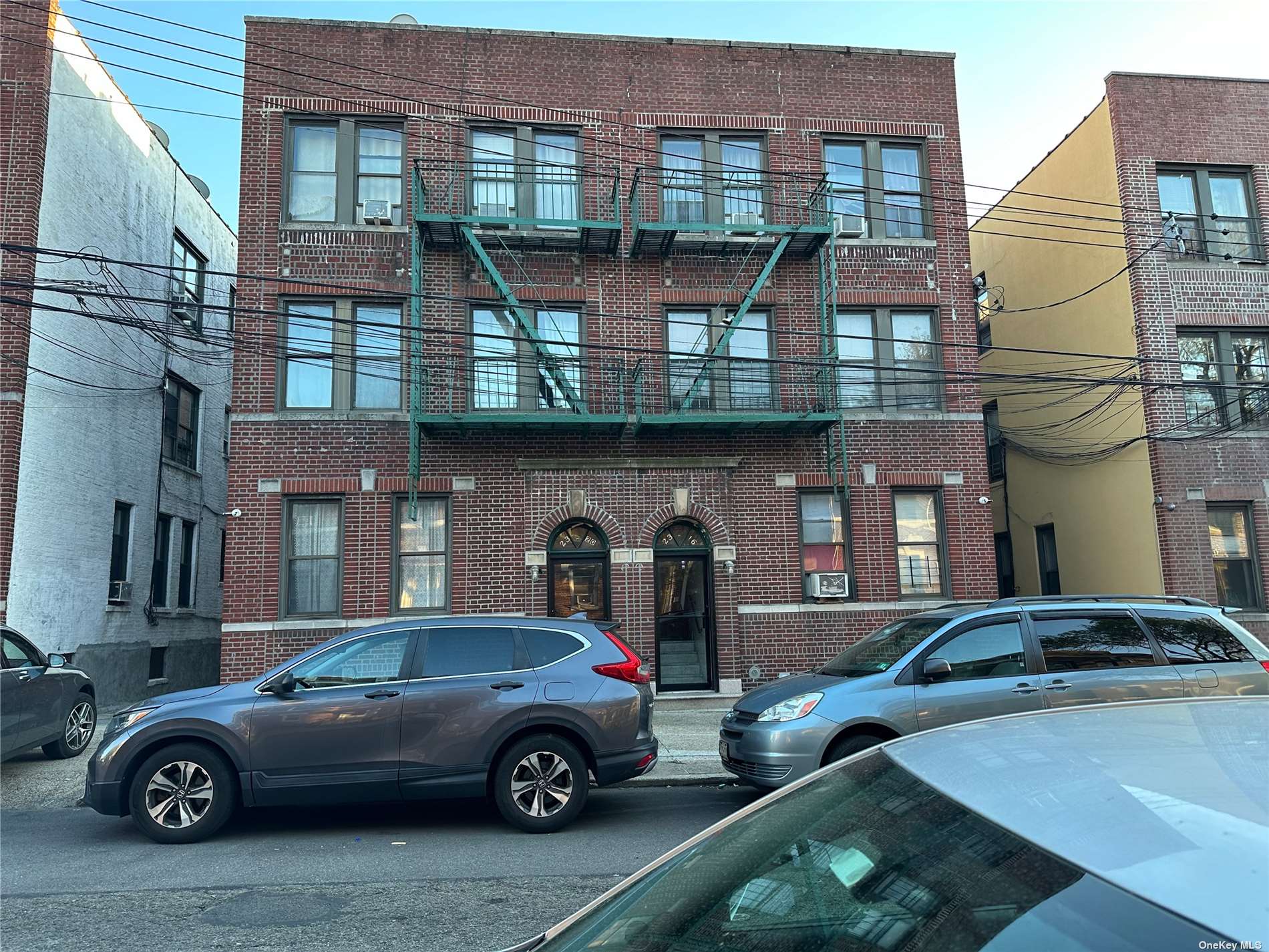 a front view of a house with parking space