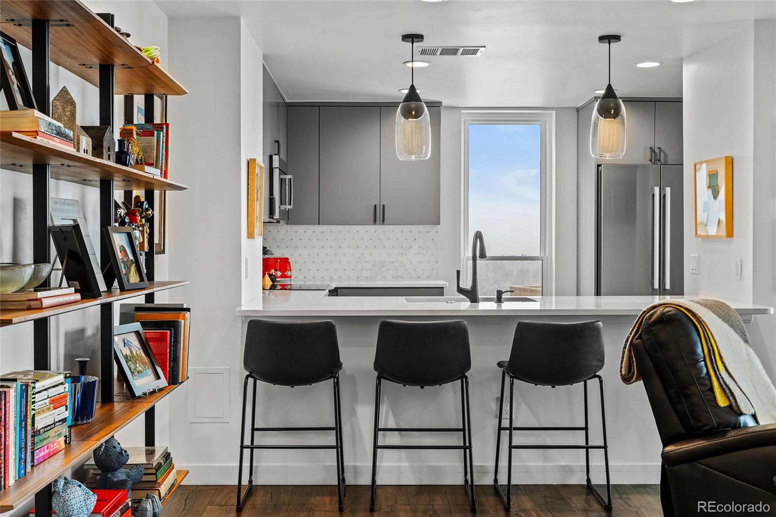 a kitchen with a table and chairs