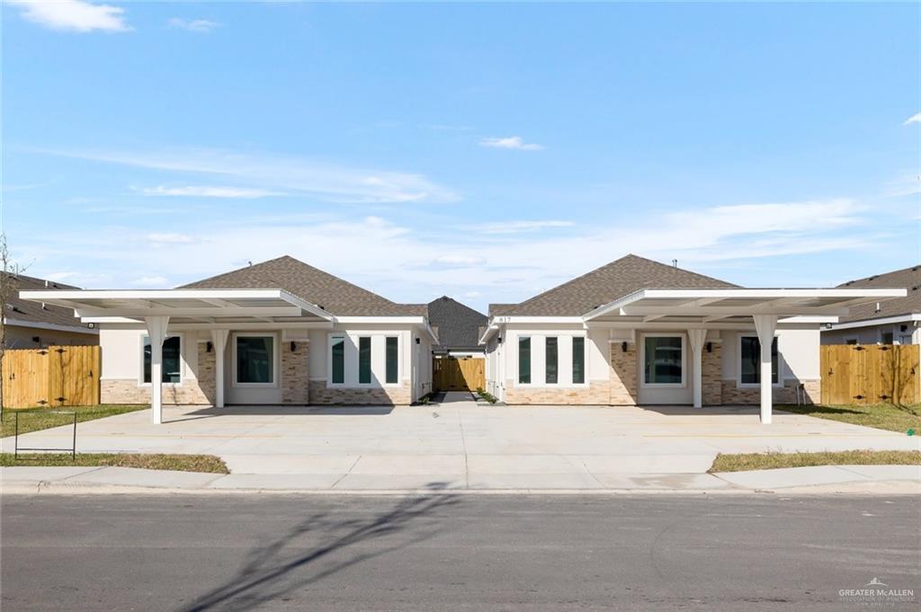 a front view of a house wth yard