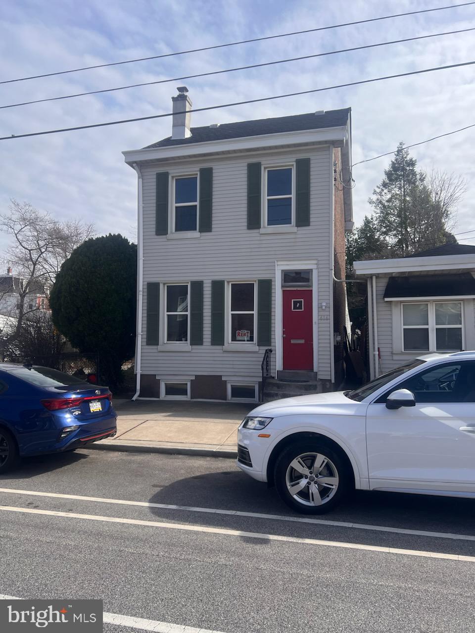 a car parked in front of a house