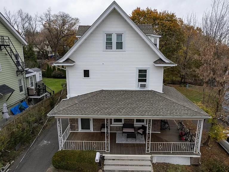 a aerial view of a house with a yard