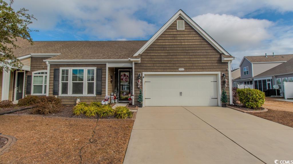 View of front of home featuring a garage