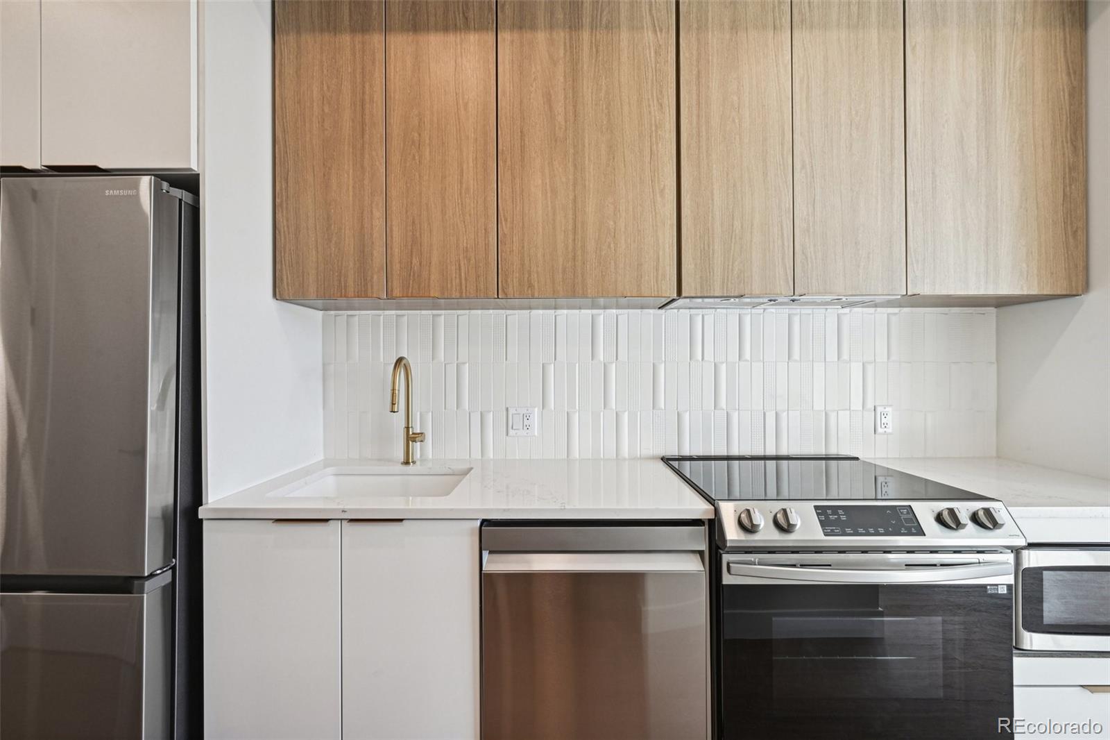 a kitchen with appliances and cabinets