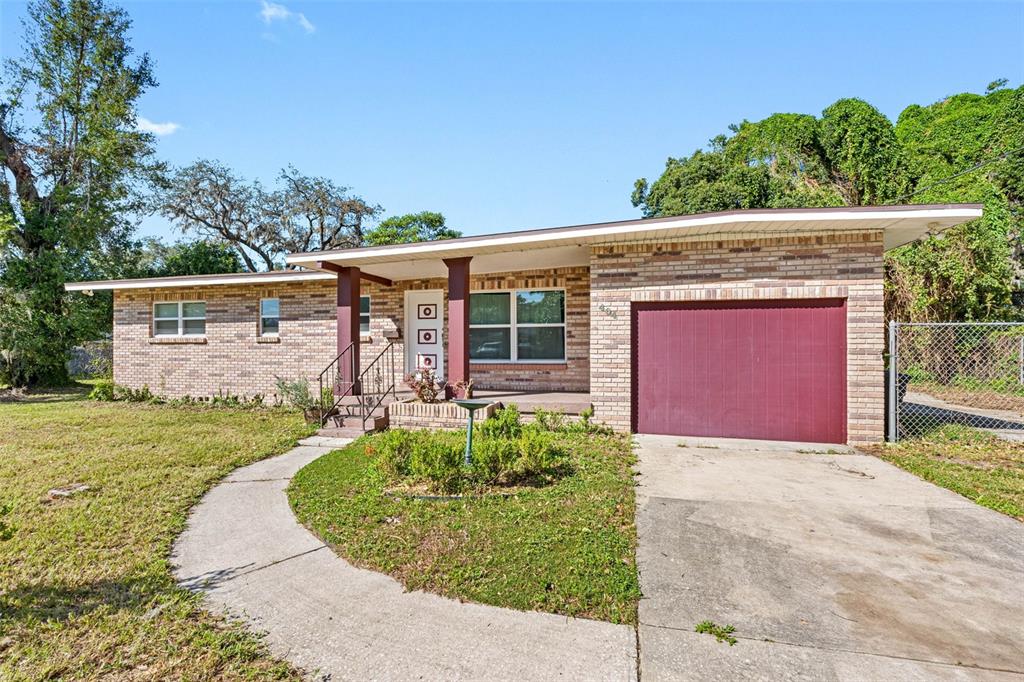 front view of a house with a yard