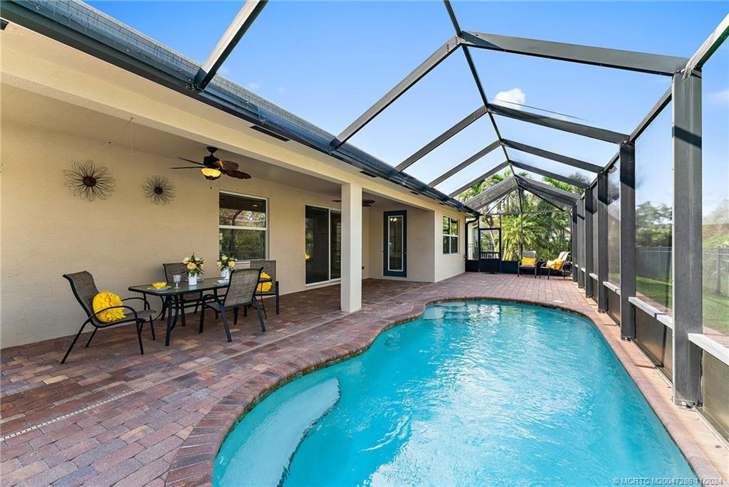 a view of a swimming pool with a patio