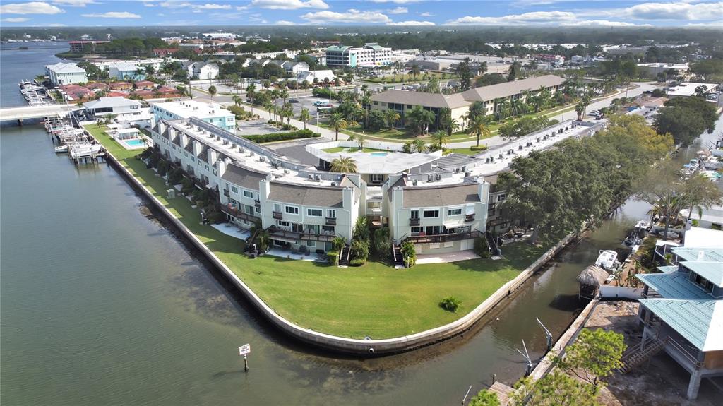 an aerial view of a house with outdoor space swimming pool