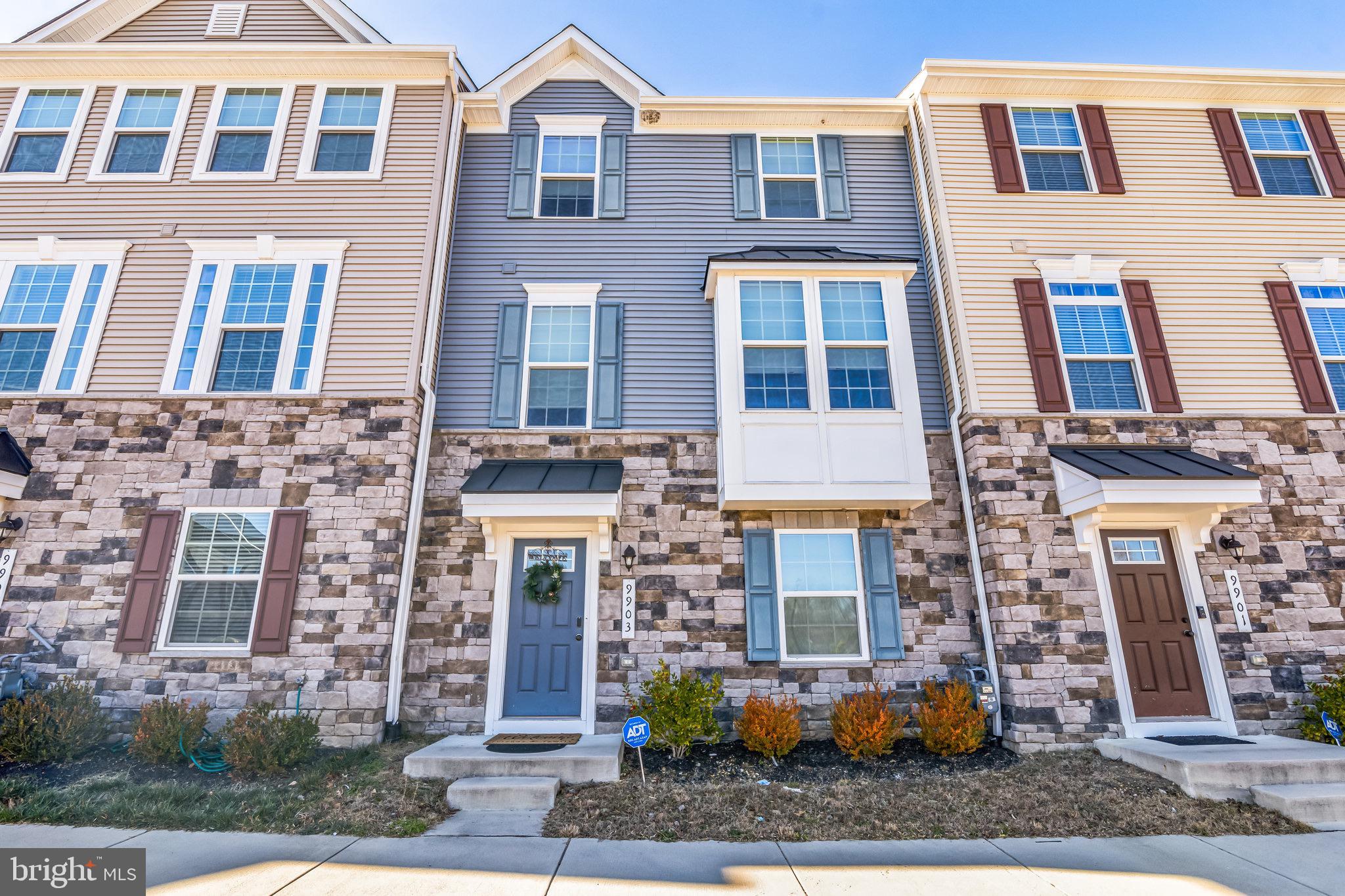 a front view of a multi story residential apartment building