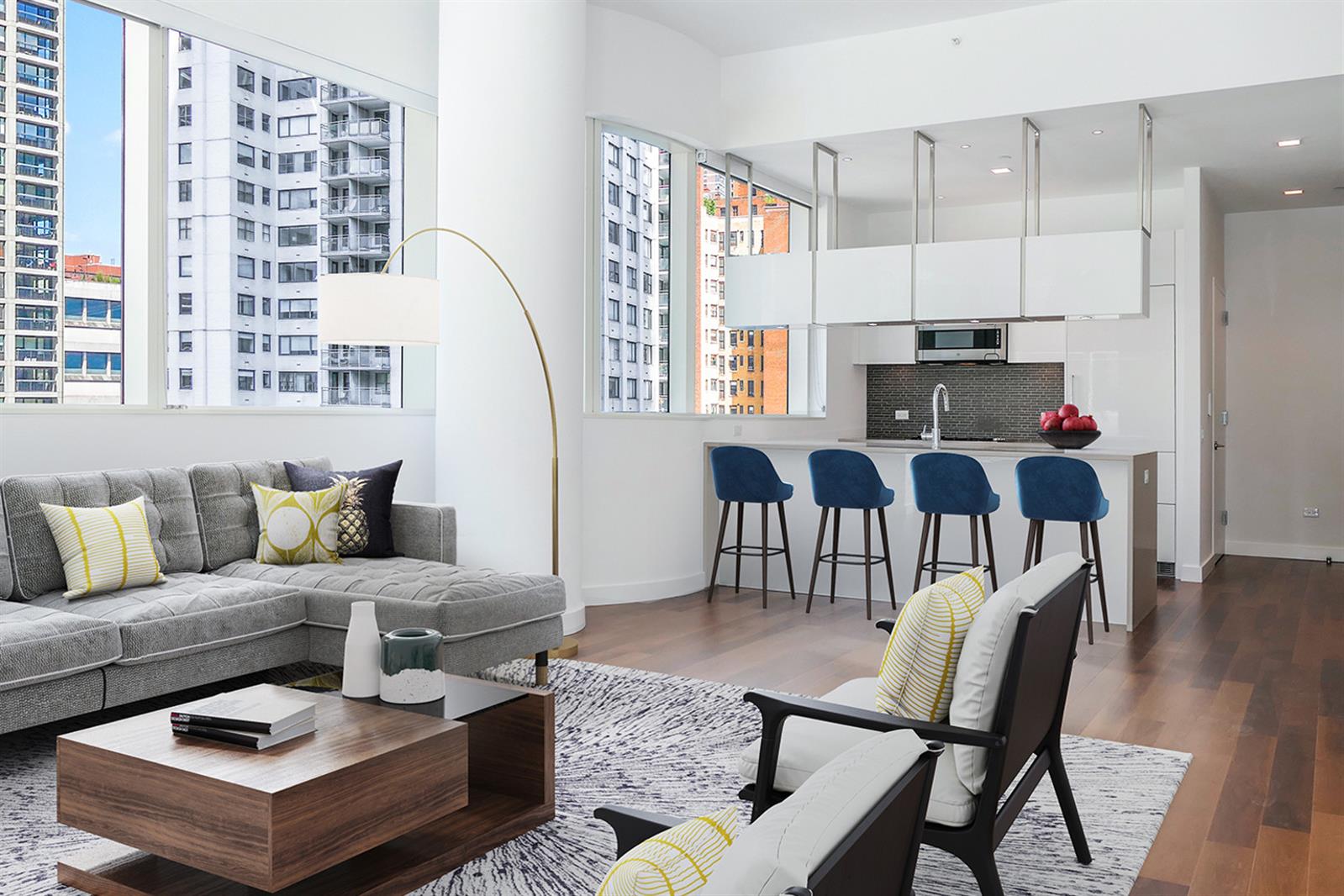 a living room with furniture a rug and a chandelier