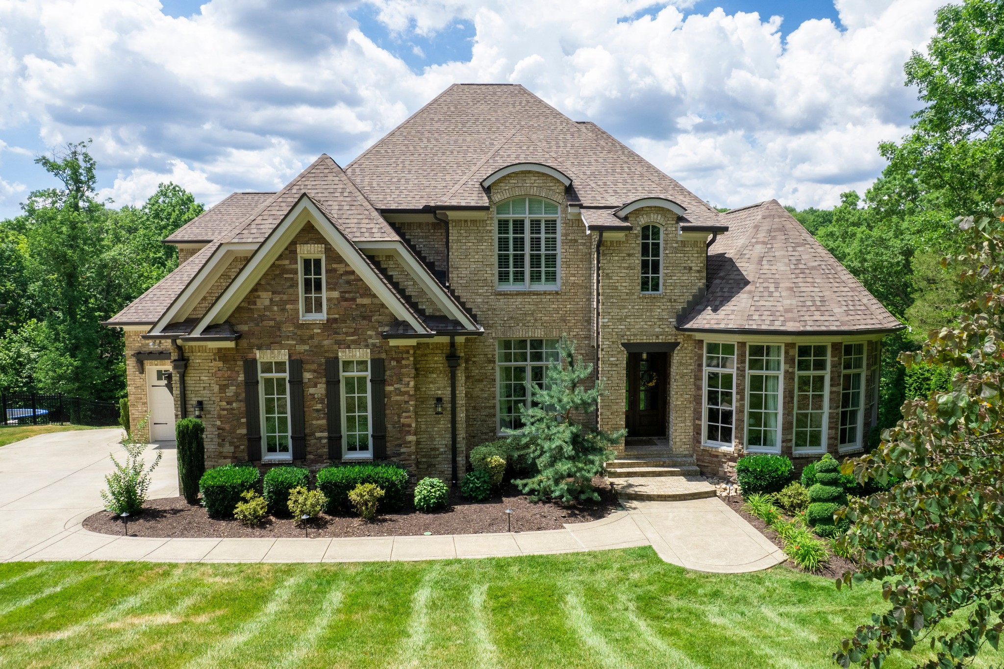 a front view of a house with a yard