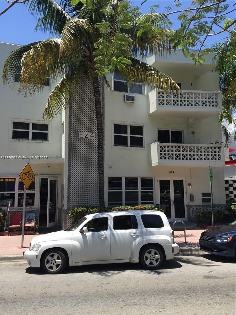 a front view of a house with parking space