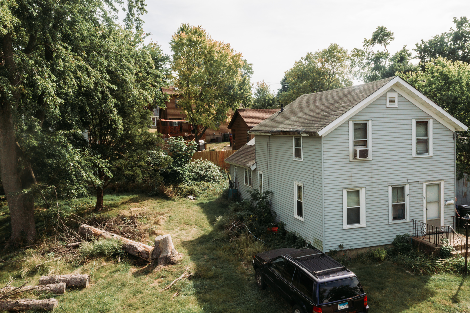 a view of backyard of house with outdoor seating