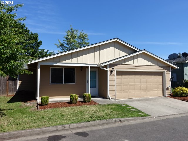 a front view of house with garage