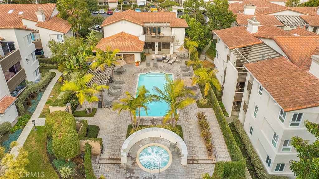 an aerial view of a house with a swimming pool