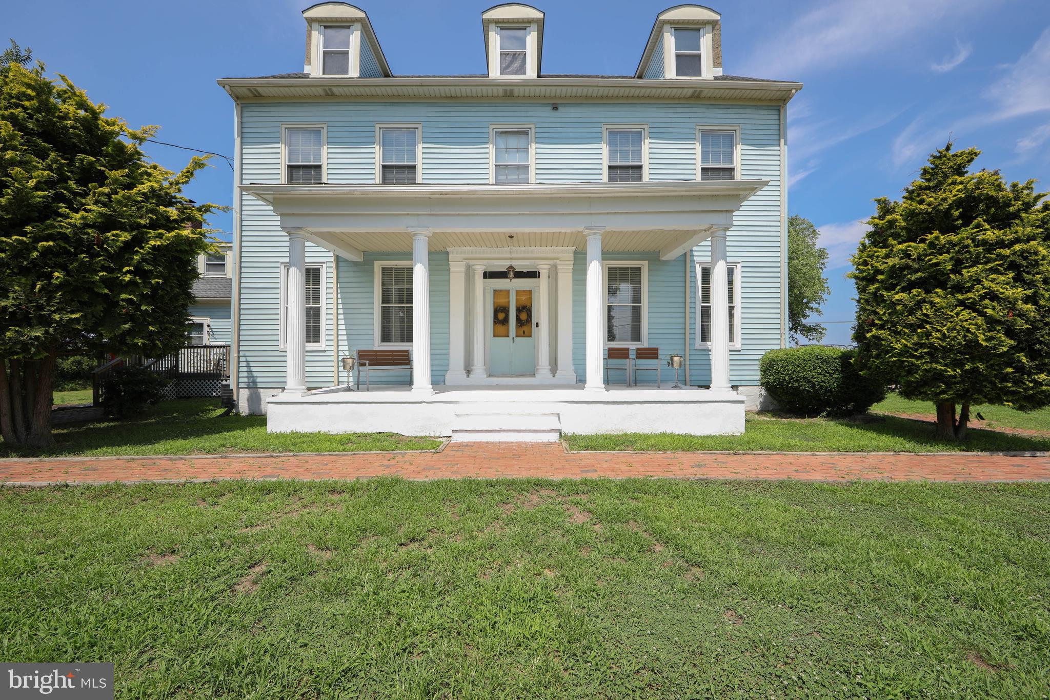 front view of a house with a yard