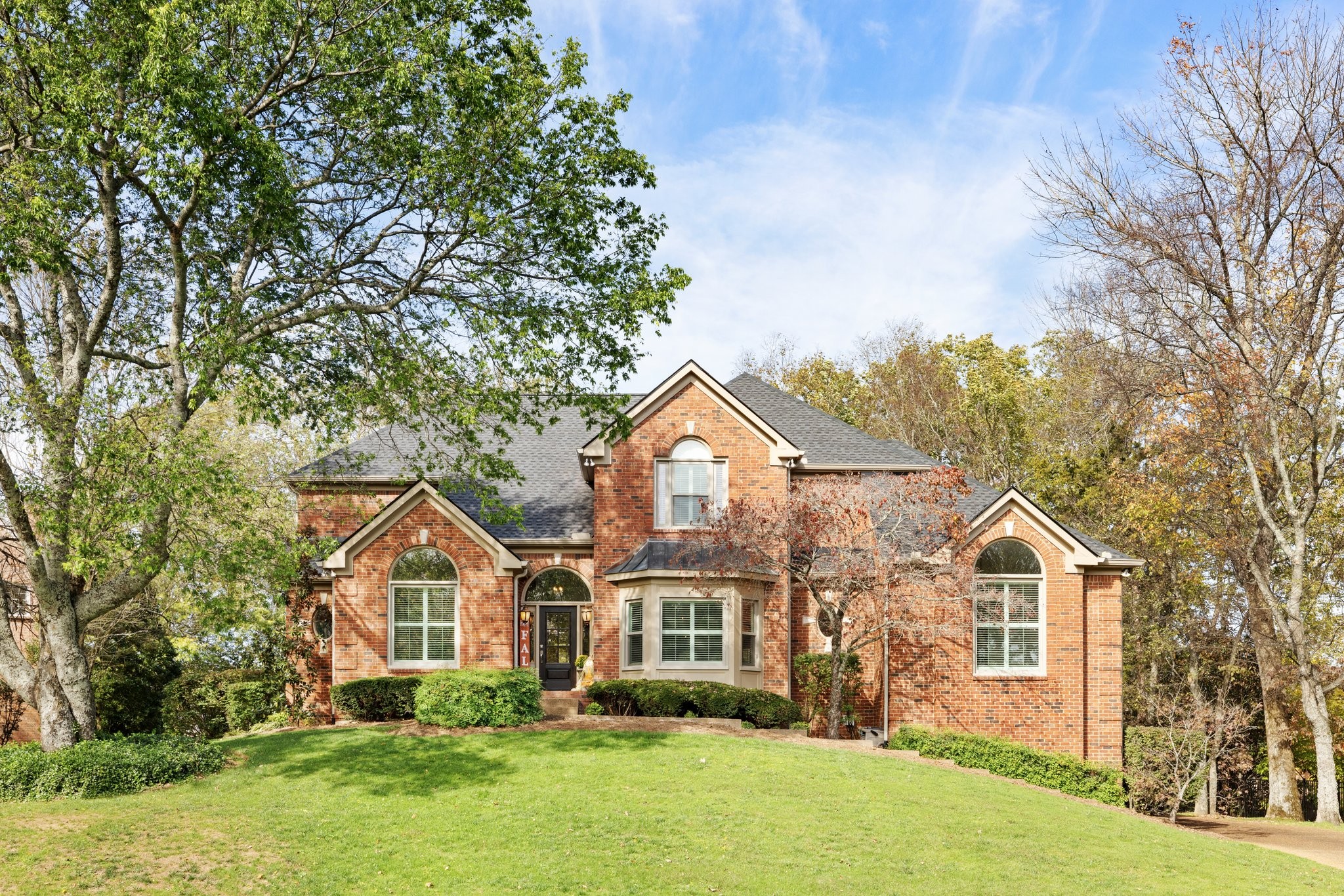 front view of a house with a yard